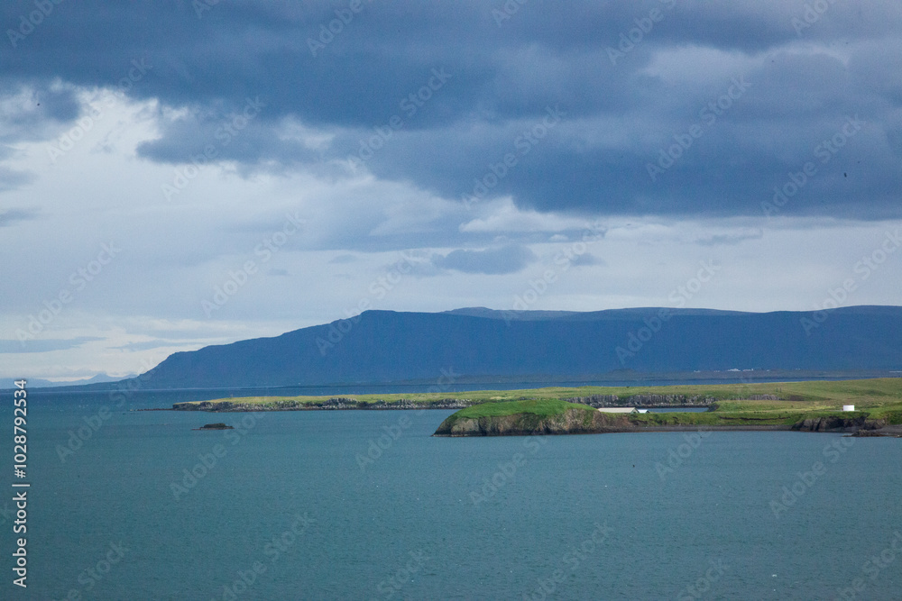Iceland mountain at the shore with clouds Iceland mountain at the shore with clouds