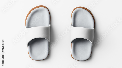 Pair of minimalist white slide sandals with light gray footbeds on a plain white background, shown from a top-down perspective. photo