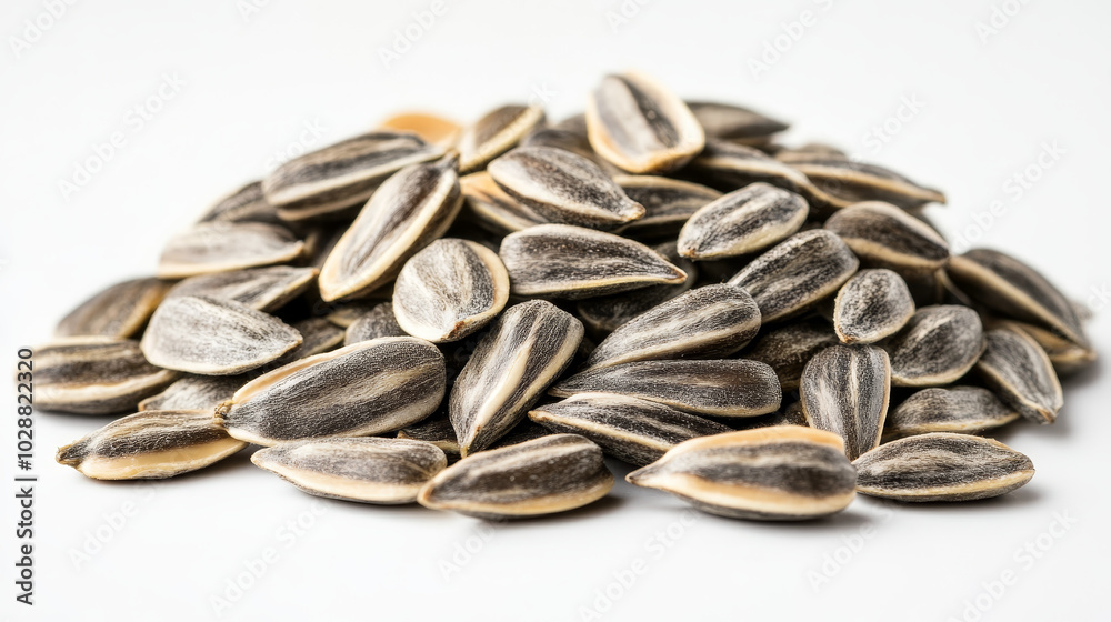 A visually appealing image of a pile of peeled sunflower seeds isolated on a white background. The raw sunflower kernels are displayed in a way that highlights their natural texture and color, A visually appealing image of a pile of peeled sunflower seeds isolated on a white background. The raw sunflower kernels are displayed in a way that highlights their natural texture and color,