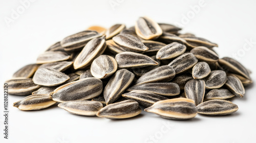 A visually appealing image of a pile of peeled sunflower seeds isolated on a white background. The raw sunflower kernels are displayed in a way that highlights their natural texture and color,