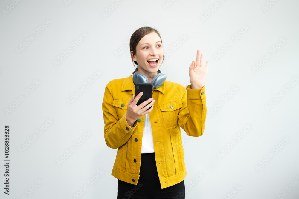 Young Caucasian woman 20s wears casual clothes stand on toes dance lean back have fun spreading hands isolated on plain light white background Young Caucasian woman 20s wears casual clothes stand on toes dance lean back have fun spreading hands isolated on plain light white background