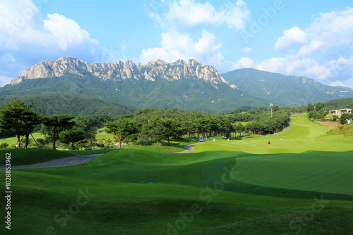 Delfino Golf and Resort, Goseong-gun, Gangwon-do, Korea - August 17, 2019: Golf courses with the background of Ulsan Rocks of Seoraksan Mt. photo