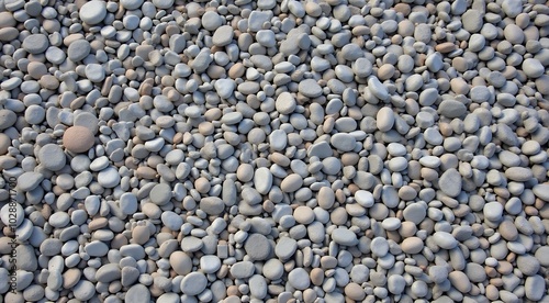 Background of smooth pebbles in grey tones for textures and design concepts