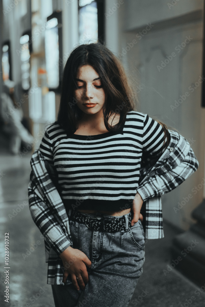 Chic Brunette Posing Near Theater at Night