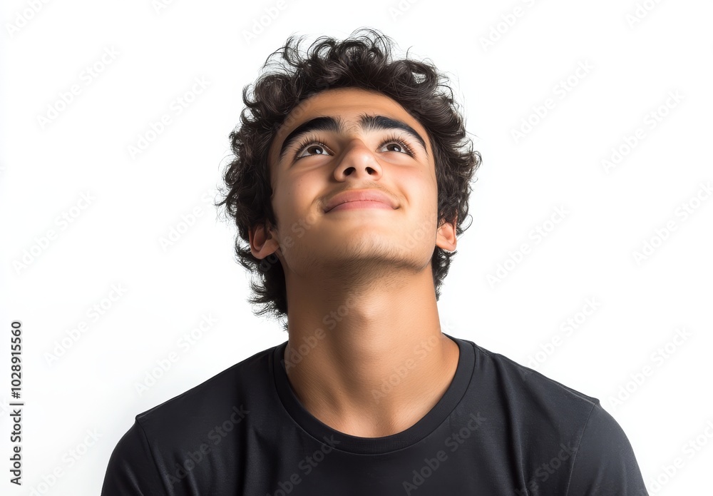 A close-up shot of a teenage boy in eyeglasses looking up deep thinking and feeling happy getting an answer to a question isolated on white space deep thinking creative concept. A close-up shot of a teenage boy in eyeglasses looking up deep thinking and feeling happy getting an answer to a question isolated on white space deep thinking creative concept.