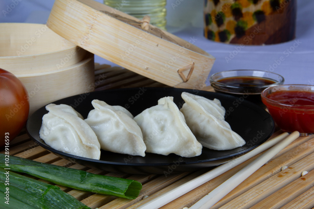 Freshly Made Gyozas with Savory Filling and Soy Sauce Freshly Made Gyozas with Savory Filling and Soy Sauce