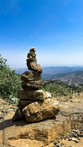 A tower of stones on Mount Olympos. Cyprus, June 2024. View from the mountains