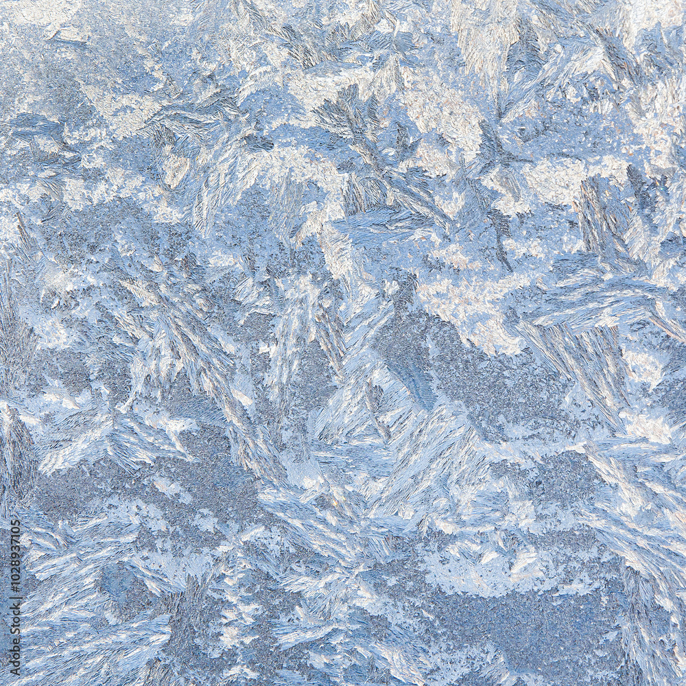 Obraz premium Frost patterns on glass as a background