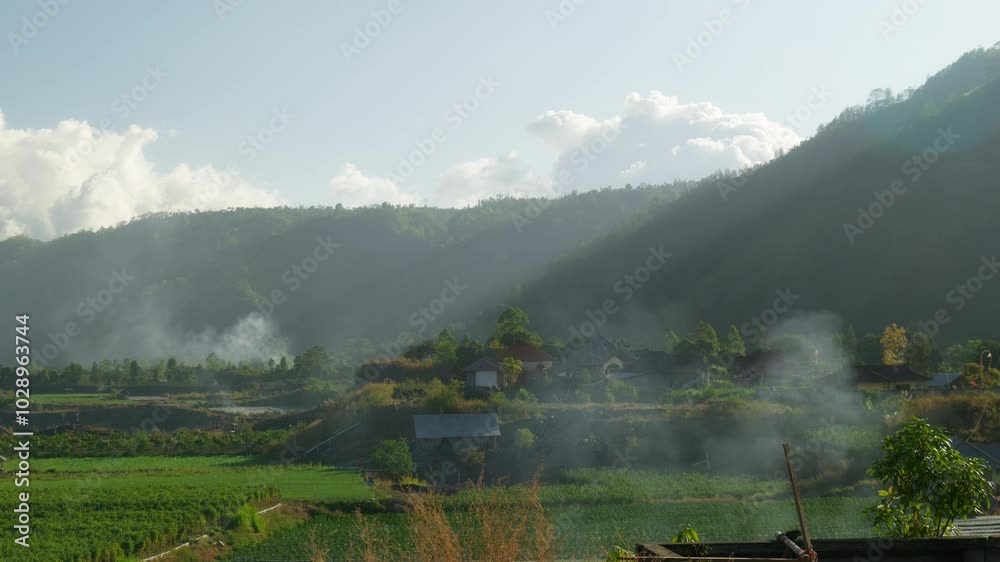 Video of a green valley on a Bali island in Indonesia with clouds and smoke. Video of a green valley on a Bali island in Indonesia with clouds and smoke.