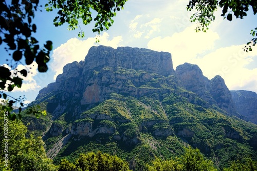 
Panoramic view over the steep and green cliffs of the Vikos Gorge in Epirus, Greece on a summer's day. The gorge in the Pindus Mountains is one of the deepest gorges in the world. Hiking in Greece photo