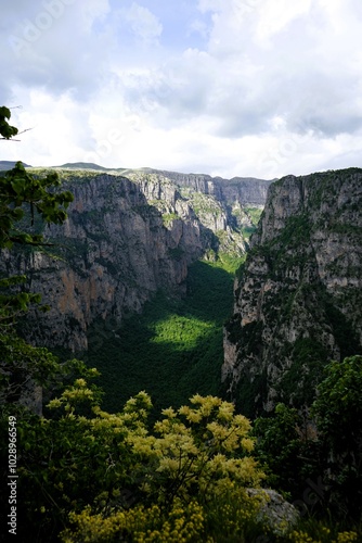 
Panoramic view over the steep and green cliffs of the Vikos Gorge in Epirus, Greece on a summer's day. The gorge in the Pindus Mountains is one of the deepest gorges in the world. Hiking in Greece photo