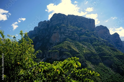 
Panoramic view over the steep and green cliffs of the Vikos Gorge in Epirus, Greece on a summer's day. The gorge in the Pindus Mountains is one of the deepest gorges in the world. Hiking in Greece photo