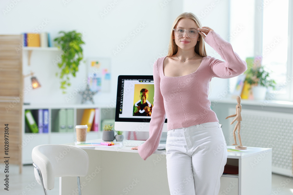 Portrait of beautiful young designer in office Portrait of beautiful young designer in office