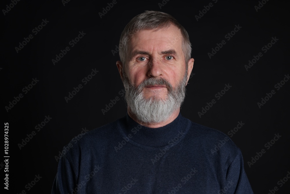 Portrait of senior man on black background Portrait of senior man on black background