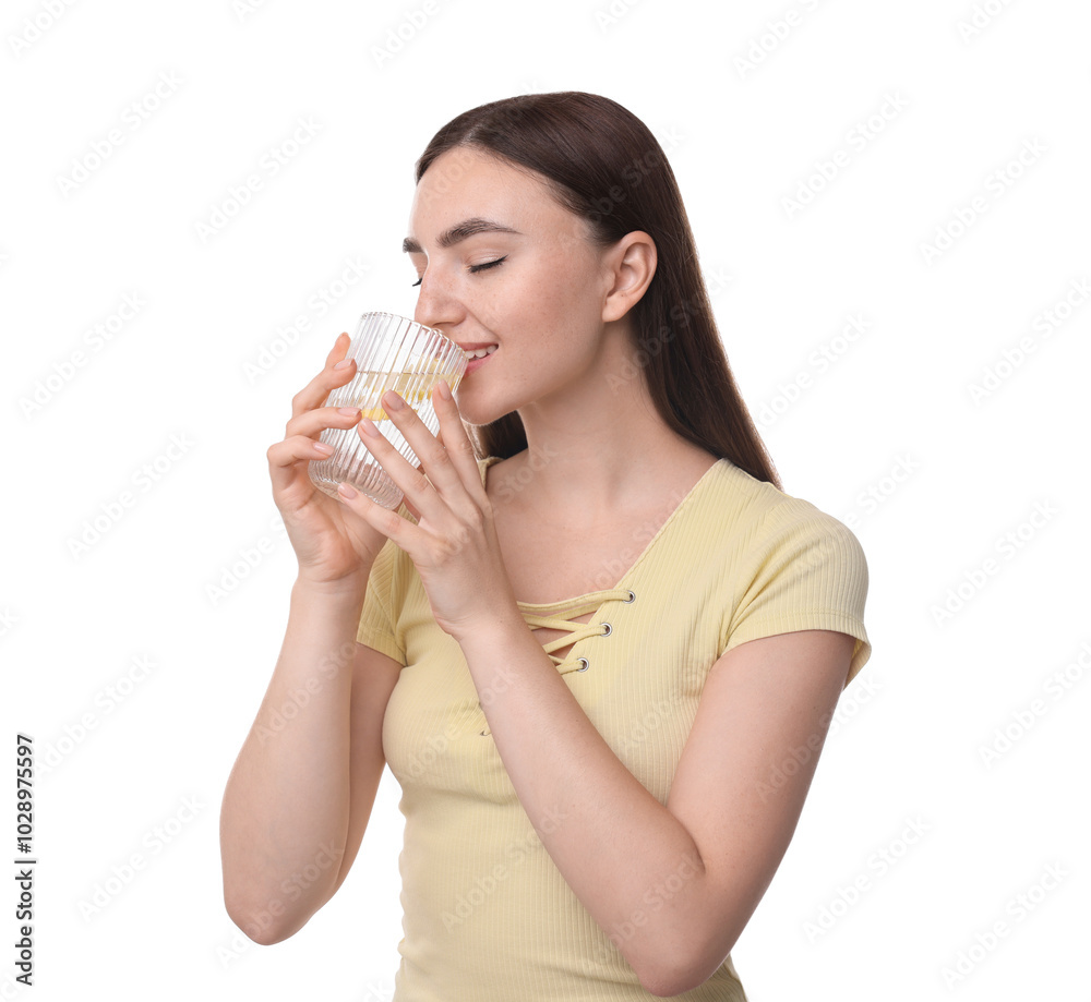 Woman drinking water with lemon on white background Woman drinking water with lemon on white background