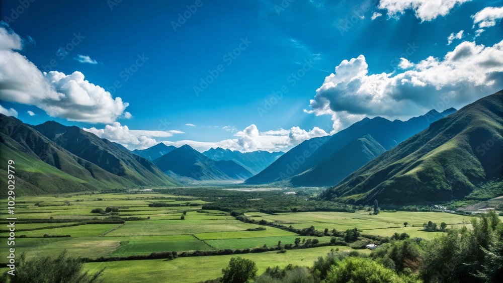 A charming valley view providing a wide area for text, accented by stunning mountain ranges, a serene blue sky, and a sweeping landscape of greenery. A charming valley view providing a wide area for text, accented by stunning mountain ranges, a serene blue sky, and a sweeping landscape of greenery.