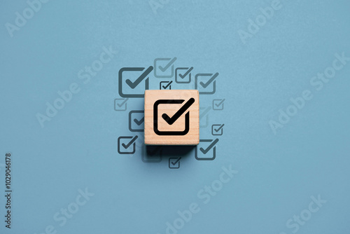 Canvas Print Black correct sign mark on wooden block cube for project and document approval concept