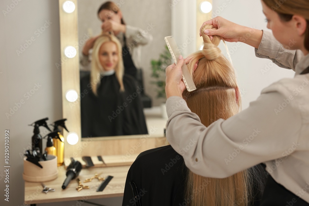 Hair cutting. Professional hairdresser working with client in salon Hair cutting. Professional hairdresser working with client in salon