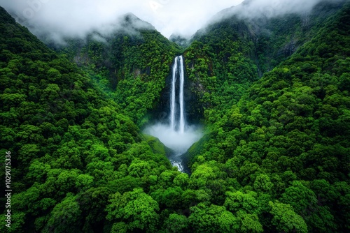 A towering waterfall hidden deep within a magical forest, with mist rising from the cascading water and the trees surrounding the area bathed in soft morning light