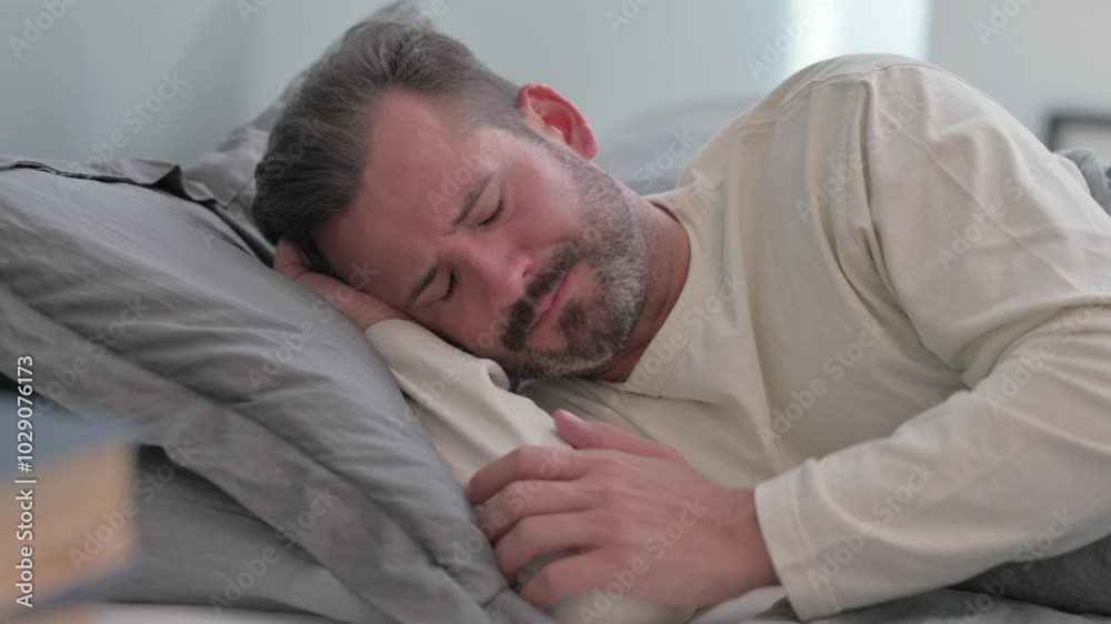 Coughing Sick Middle Aged Man Lying on Side in Bed Coughing Sick Middle Aged Man Lying on Side in Bed