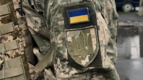 Yellow and blue chevron on the uniform of a Ukrainian soldier, a symbol of patriotism, defender of Ukraine, a sign of victory