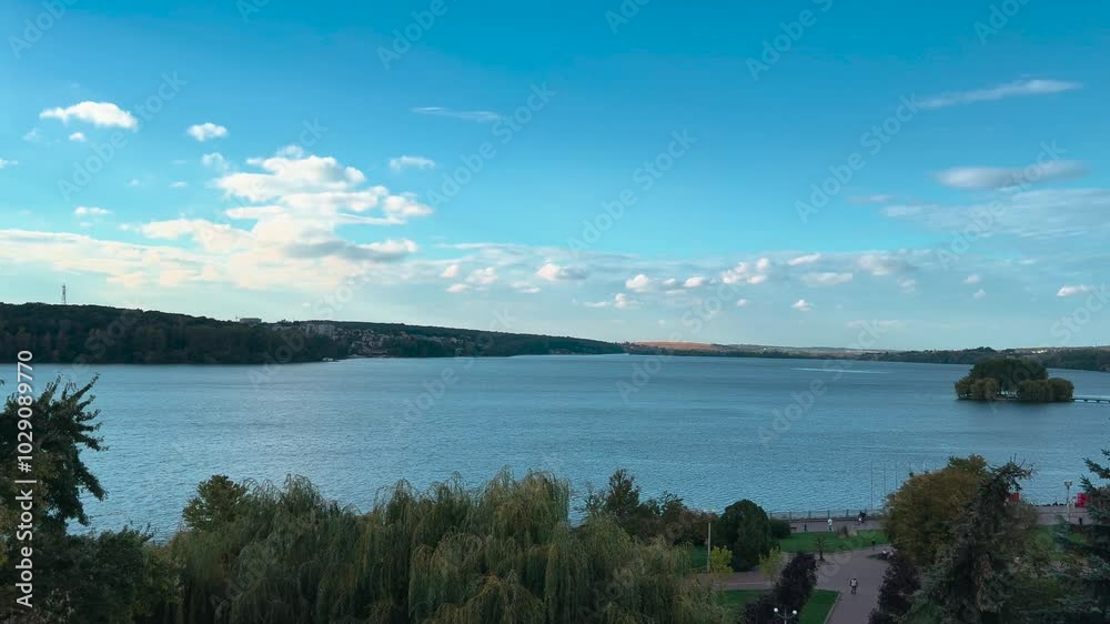 Idealistic landscape, lake surrounded by park, view from above. Nice place, beautiful view from the window