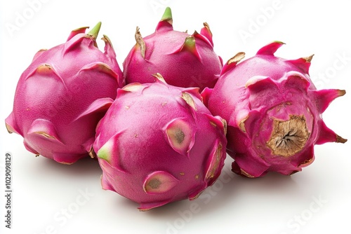 Wallpaper Mural A group of fresh dragon fruits with vivid pink skin and green-tipped spikes is arranged on a white background. the exotic fruits showcase their unique texture and vibrant colors, ideal for healthy Torontodigital.ca