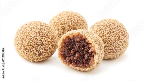 Chinese sesame balls (jian dui) filled with red bean paste, golden and crispy, isolated on white background