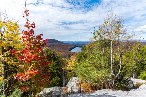 View of a lake and foliage from the top of a mountain photo