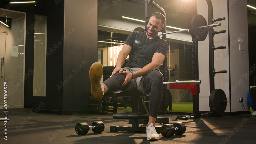 Φωτογραφία African American unwell man sad suffering with knee pain in sport club workout t