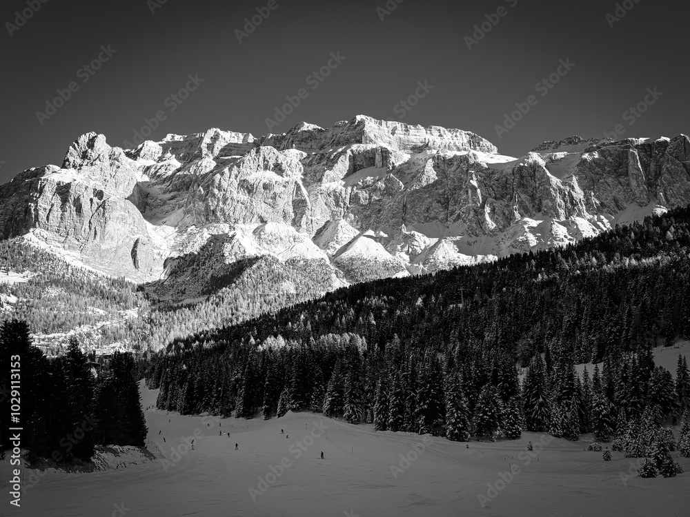 Scenic view of Sella group mountain massif in South Tyrol, Italy covered with snow against clear sky in black and white