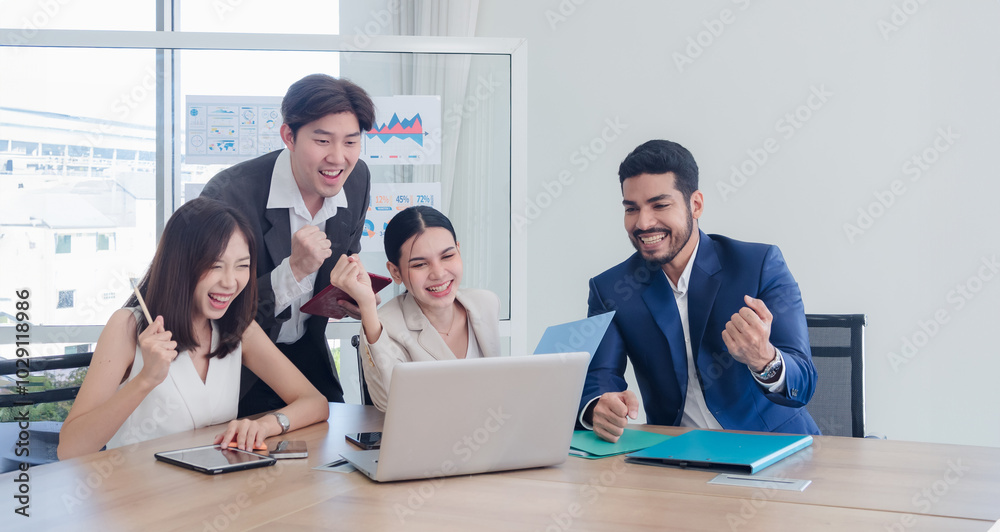 Business team woman and man asian group meeting sitting on desk looking talk think creative idea computer on table ready happy working new project job online product sale marketing in office company. Business team woman and man asian group meeting sitting on desk looking talk think creative idea computer on table ready happy working new project job online product sale marketing in office company.