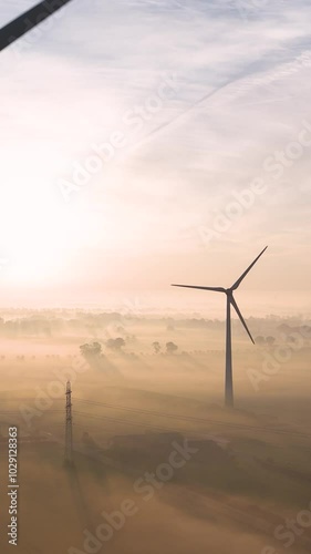 Wallpaper Mural Sun rising above wind turbines and countryside covered in fog Torontodigital.ca