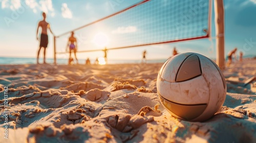 Fototapeta Naklejka Na Ścianę i Meble -  Beach volleyball sport. Close up of ball on the beach with volleyball net and players in the background, summer sport