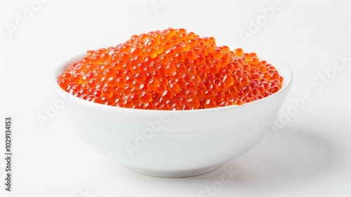 Bowl of red caviar isolated on white background photo