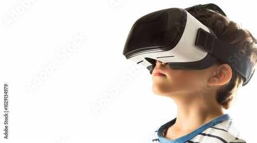 Immersed in virtual world, young boy experiences excitement of technology through VR headset. His focused expression reflects curiosity and wonder