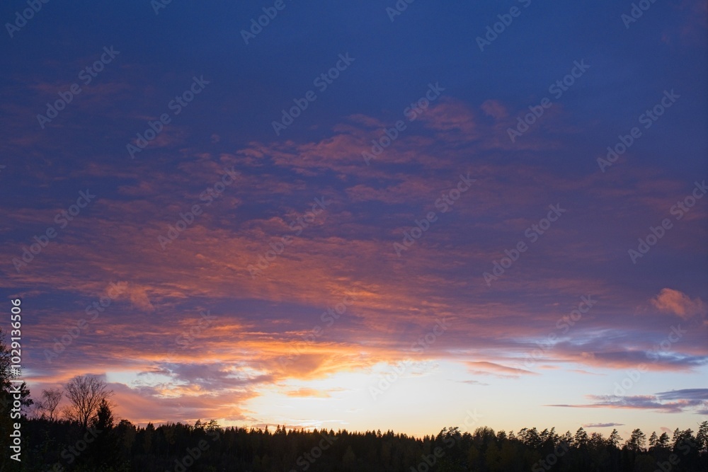 Magical sunset in winter in January over Bredebolet in Skaraborg in Vaestra Goetaland in Sweden on a cold day Magical sunset in winter in January over Bredebolet in Skaraborg in Vaestra Goetaland in Sweden on a cold day