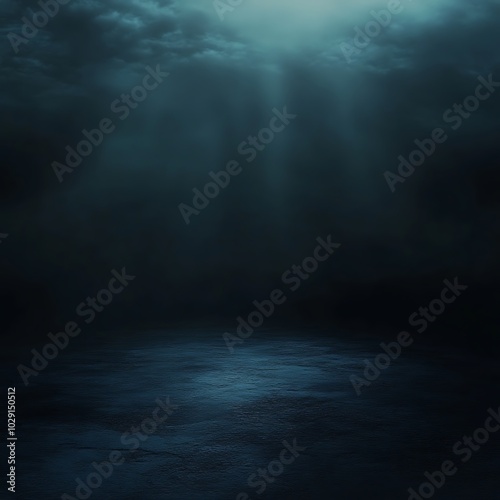 A dark underwater scene illuminated by faint light rays.