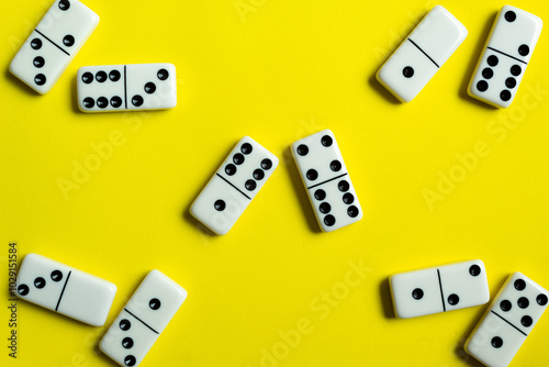 Domino tiles on yellow background