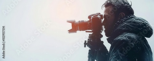 Man with video camera, white background, filmmaking photo