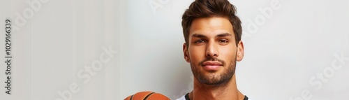 Man with basketball jersey, white background, sports attire photo