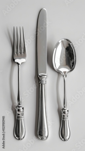 Polished silverware set, white background, 4K hyperrealistic photo