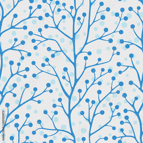 A seamless winter pattern featuring blue berry branches against a soft blue background designed for decorations and textiles