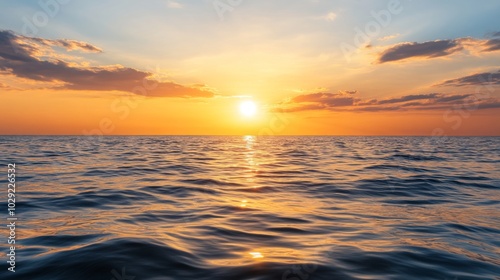 A serene sunset over the ocean creates a peaceful atmosphere