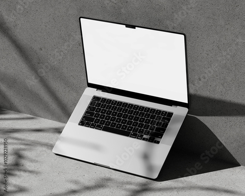 Right view laptop mockup on concrete block with tree shadow overlay