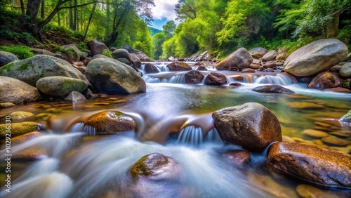 Flowing water through rocks in nature, eye level view