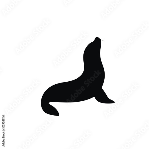 A black silhouette of a sea lion or seal on a white background 