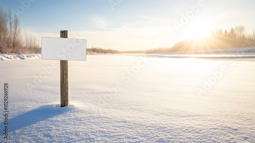 Empty sign stands in a snowy field at sunset, ready for your message