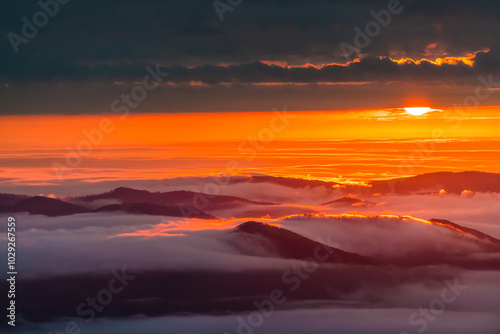 Wallpaper Mural Wintergreen Resort, Virginia sunrise of sun hiding behind clouds of mist fog above Blue Ridge mountains in autumn fall Torontodigital.ca