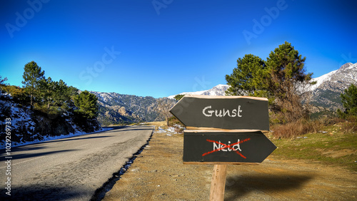 Foto Signposts the direct way to favour versus envy